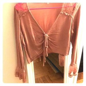 Pink laced crop top with tie and ruffled cuffs